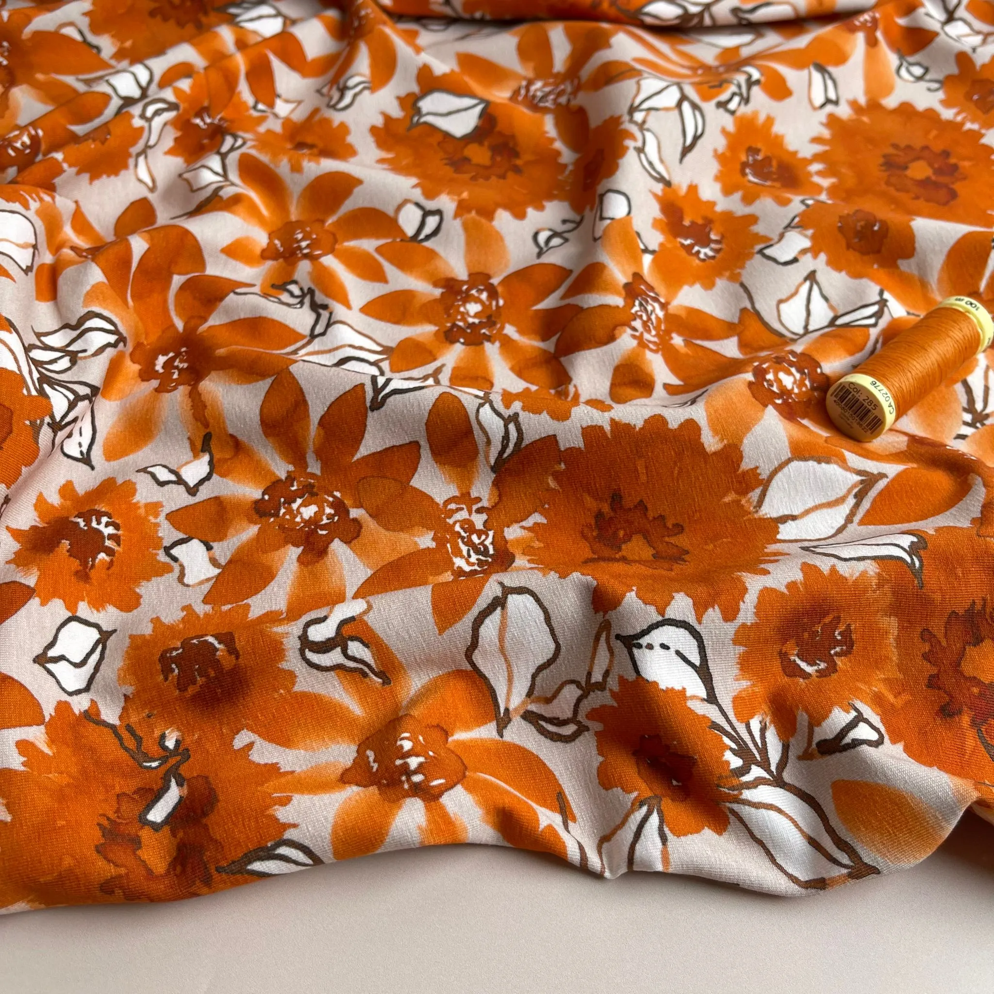 Danish Design - Rust Flowers on Pale Rose Cotton Jersey Fabric