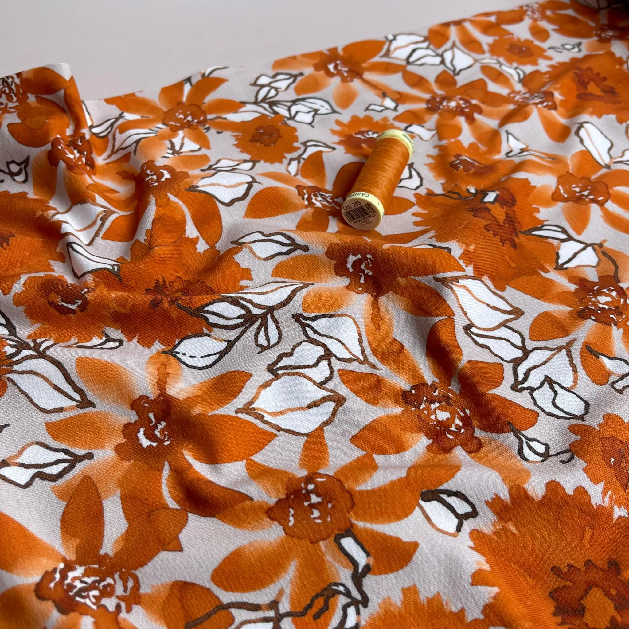 Danish Design - Rust Flowers on Pale Rose Cotton Jersey Fabric