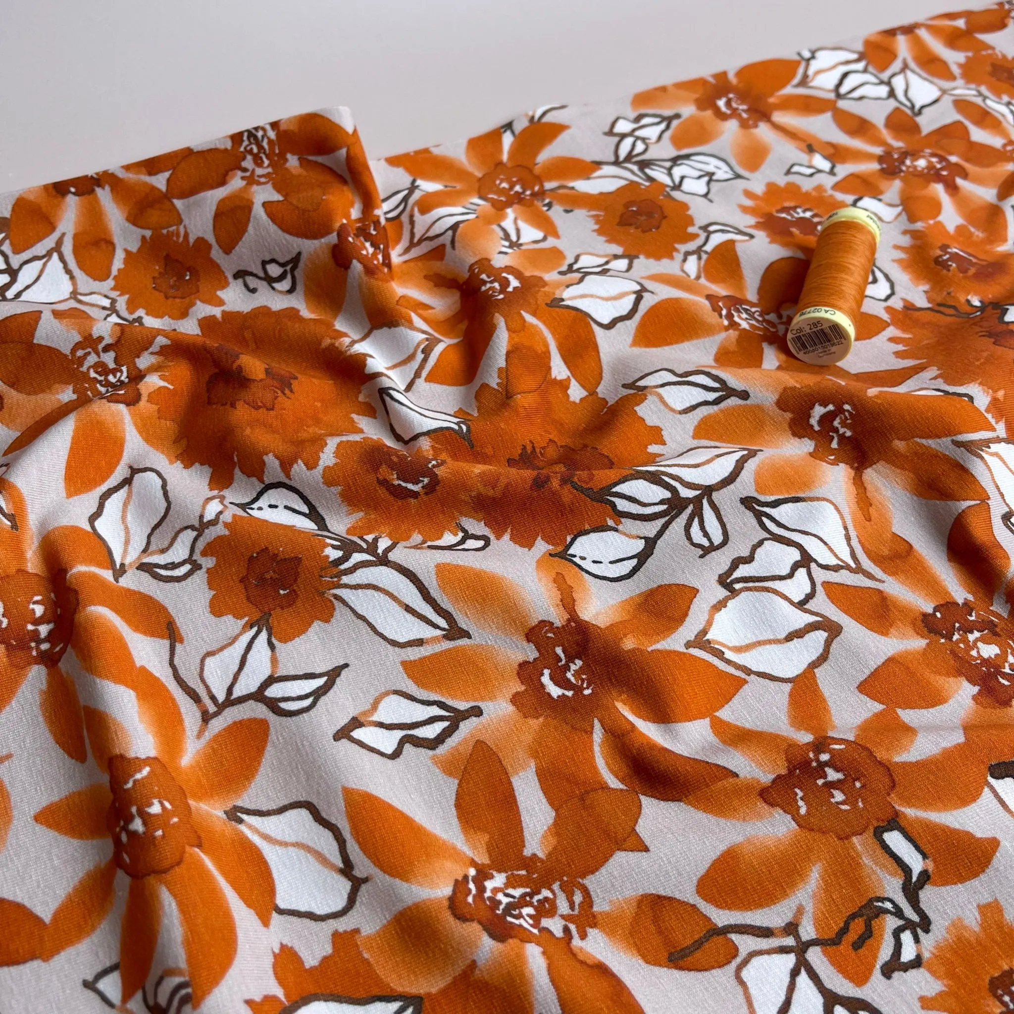 Danish Design - Rust Flowers on Pale Rose Cotton Jersey Fabric